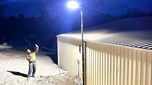 LED parking lot light installed on a pole providing bright outdoor illumination for a commercial building area at night