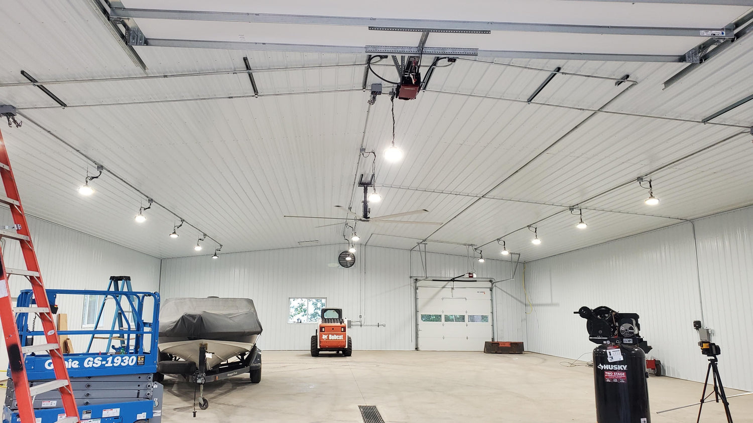 LED high bay lights installed in a warehouse providing bright industrial lighting