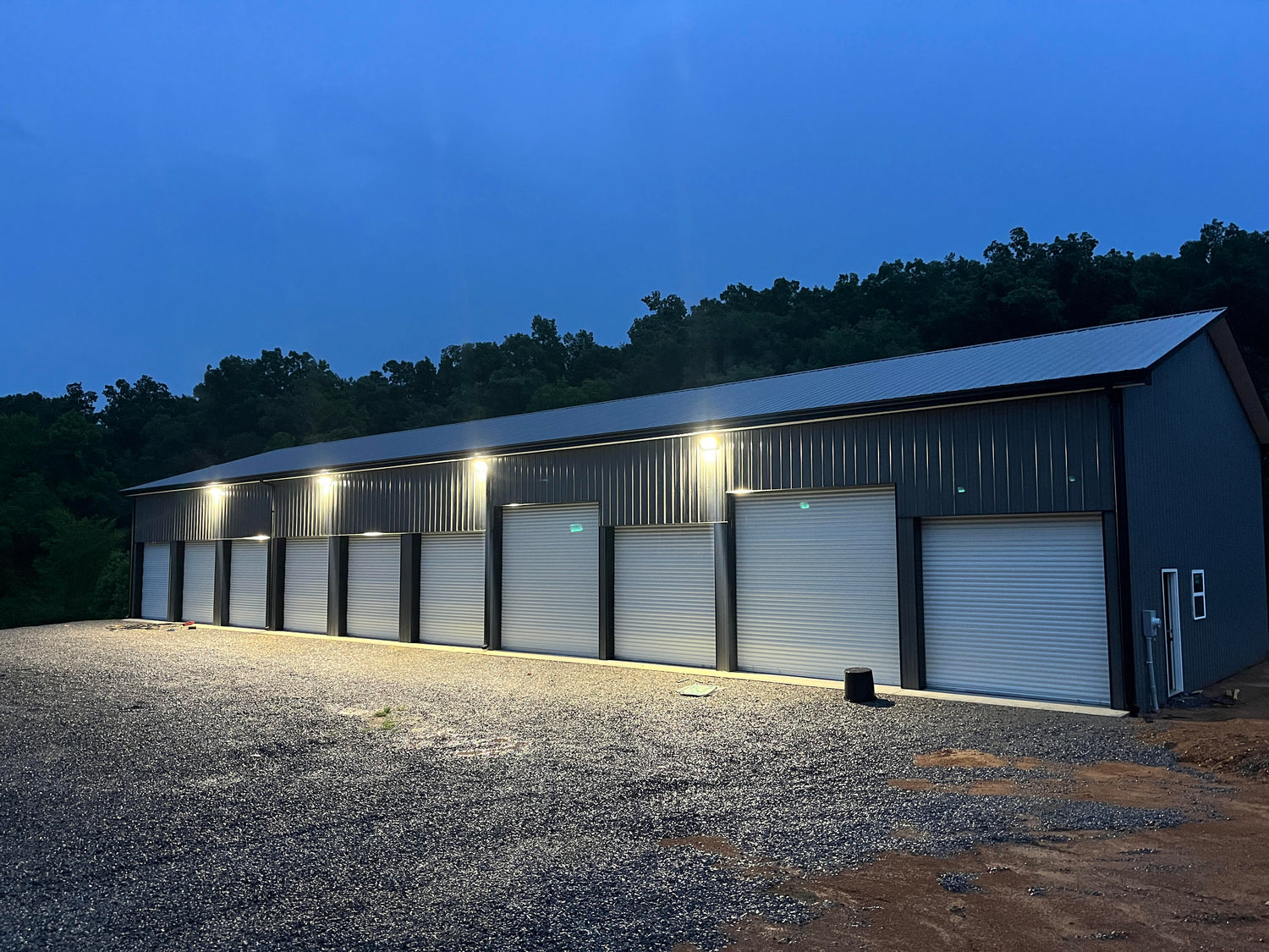 LED wall pack lights installed along a commercial building for energy-efficient outdoor lighting