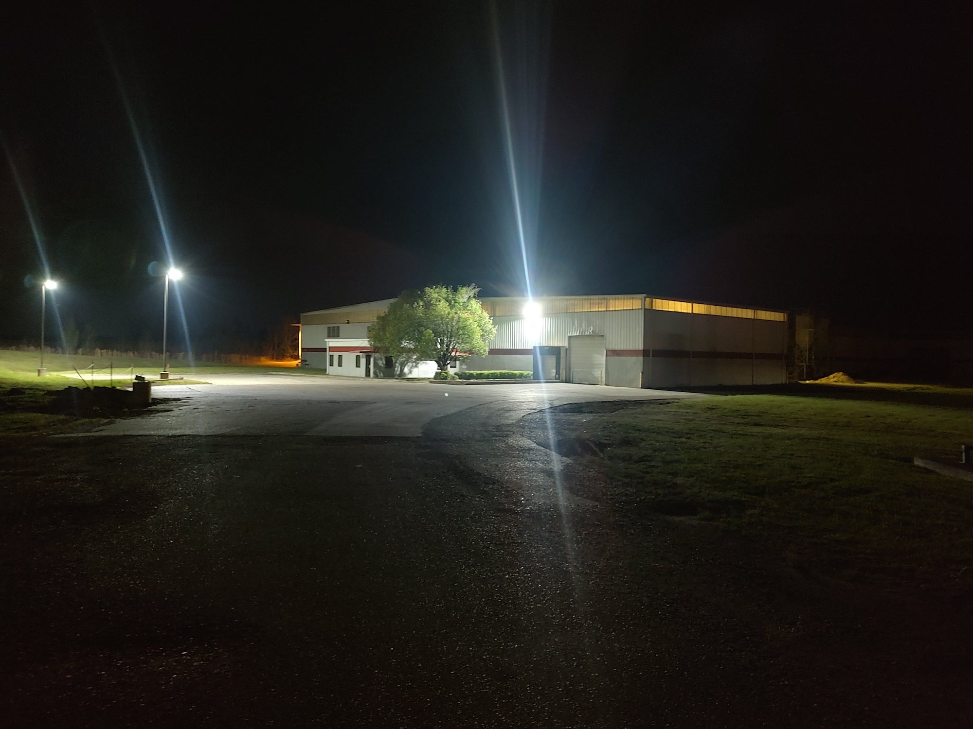 LED parking lot lights illuminating a large outdoor parking area with uniform brightness for commercial and industrial applications